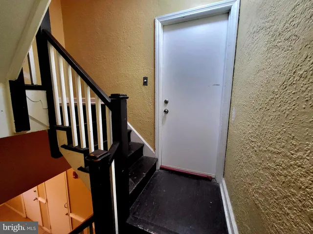 staircase with wooden floor and stairs