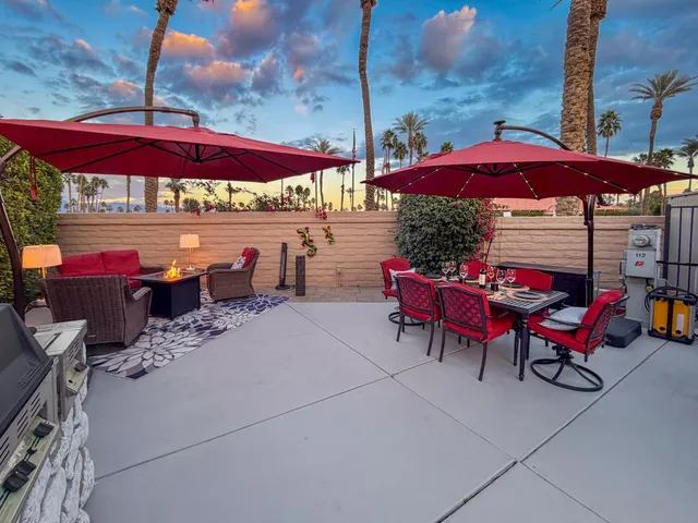 an outdoor space with patio tables and chairs