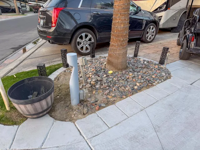 a view of a patio with table and chairs under an umbrella