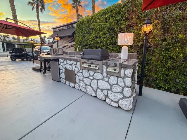 a view of a chairs and table in the patio