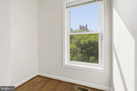 a view of a room that has a window