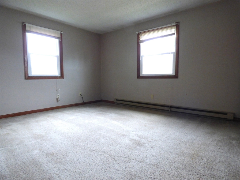 16-18 Daniel Street Springfield, MA 01151 - Photo 9 of 14 an empty room with a window