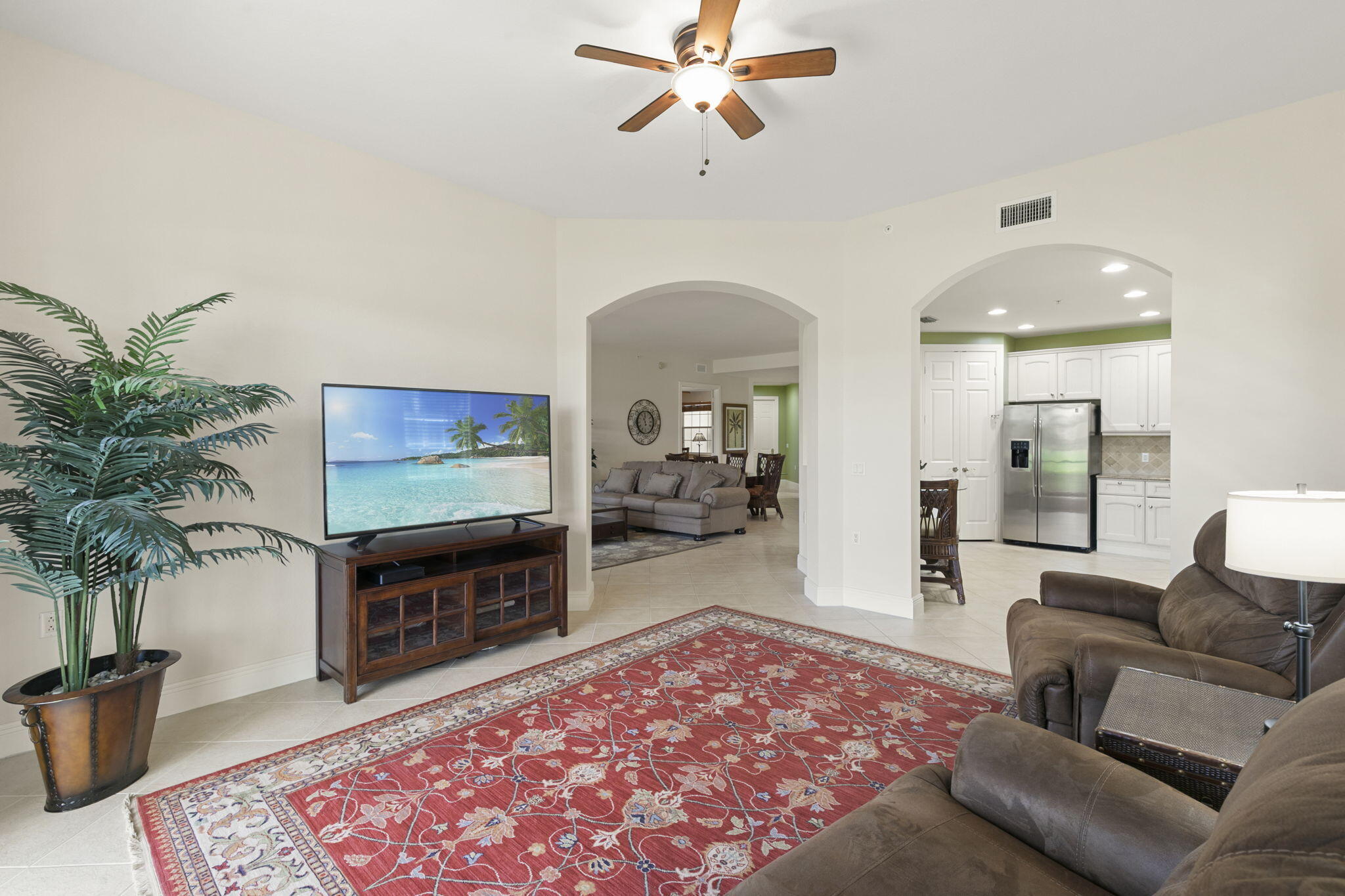 9066 Cascada Way, Unit 101 Naples, FL 34114 - Photo 12 of 51 a living room with furniture and a fireplace