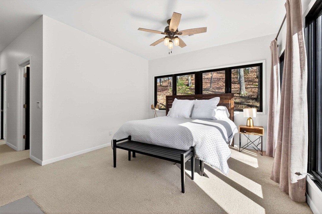 9467 Little East Fork Road Franklin, TN 37064 - Photo 14 of 26 a bedroom with a bed and a window