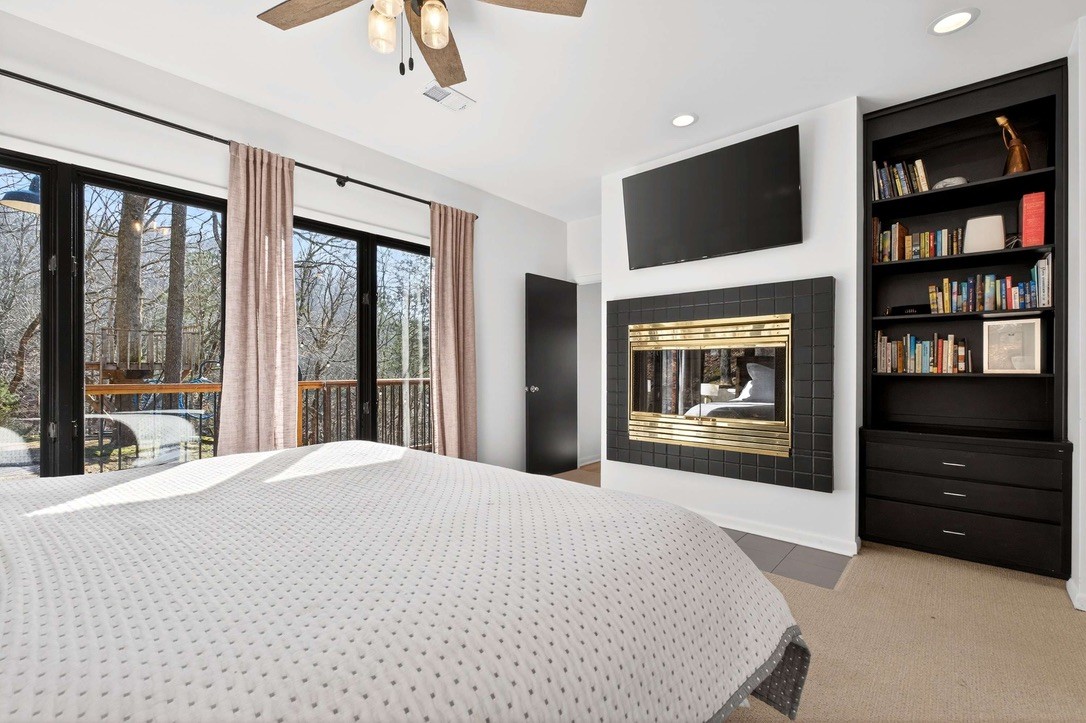 9467 Little East Fork Road Franklin, TN 37064 - Photo 15 of 26 a bedroom with a bed and a flat tv screen