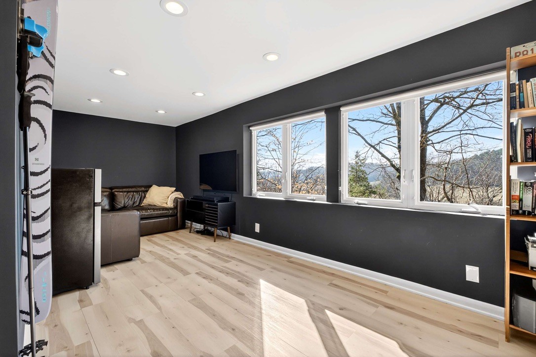 9467 Little East Fork Road Franklin, TN 37064 - Photo 24 of 26 a bedroom with a bed and a large window