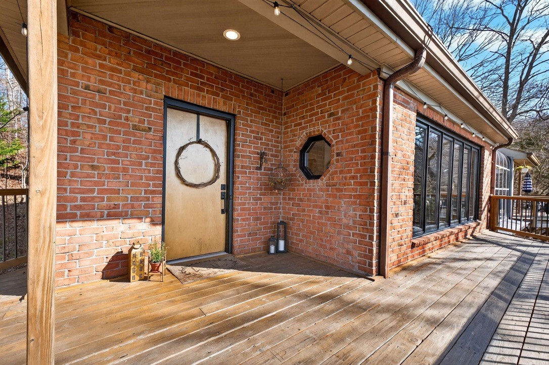 9467 Little East Fork Road Franklin, TN 37064 - Photo 5 of 26 a view of a livingroom with wooden floor and chair