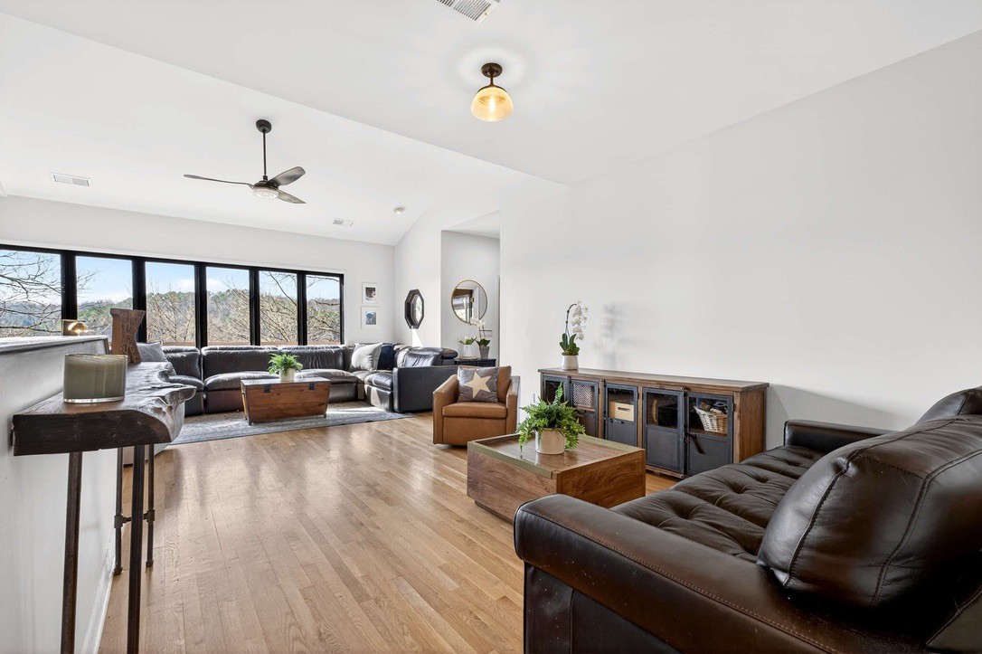 9467 Little East Fork Road Franklin, TN 37064 - Photo 7 of 26 a living room with furniture kitchen view and a large window
