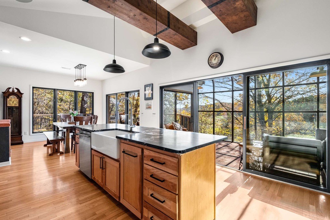 9467 Little East Fork Road Franklin, TN 37064 - Photo 10 of 26 a kitchen with stainless steel appliances granite countertop a stove and a view of living room