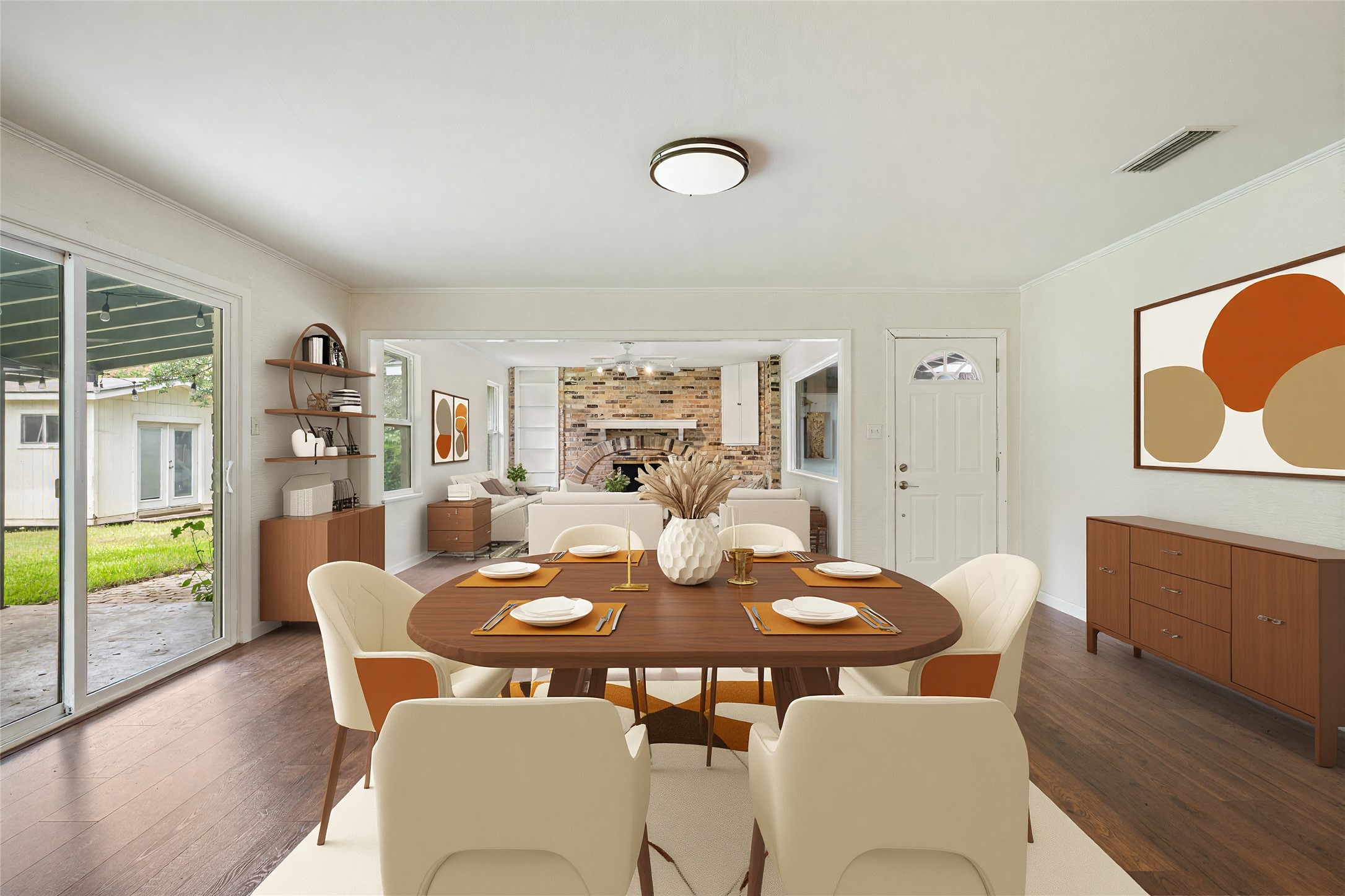 4602 Frontier Trail Austin, TX 78745 - Photo 4 of 21 Hardwood flooring extends throughout this well-lit dining area, offering seamless flow to the inviting living space.