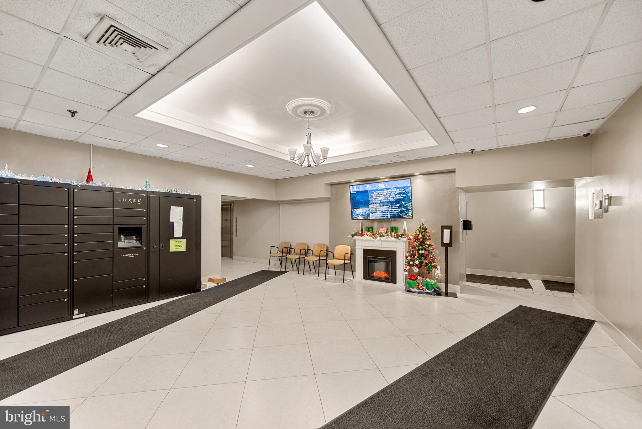 5911 Edsall Road, Unit 805 Alexandria, VA 22304 - Photo 31 of 37 a living room with stainless steel appliances kitchen island furniture and a large window