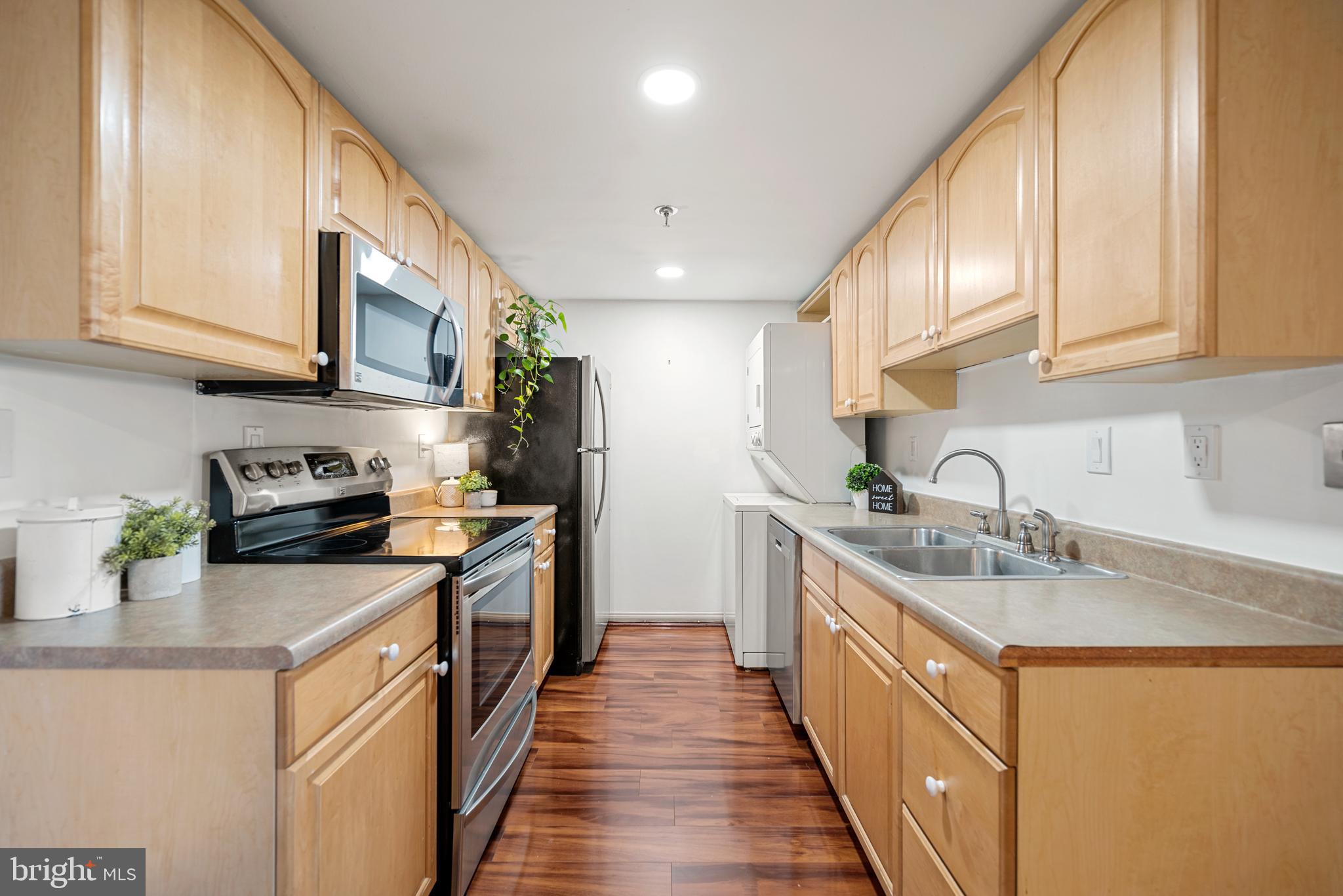 5911 Edsall Road, Unit 805 Alexandria, VA 22304 - Photo 5 of 37 a kitchen with stainless steel appliances granite countertop a sink and cabinets