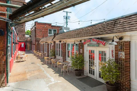 a view of a building with sitting area