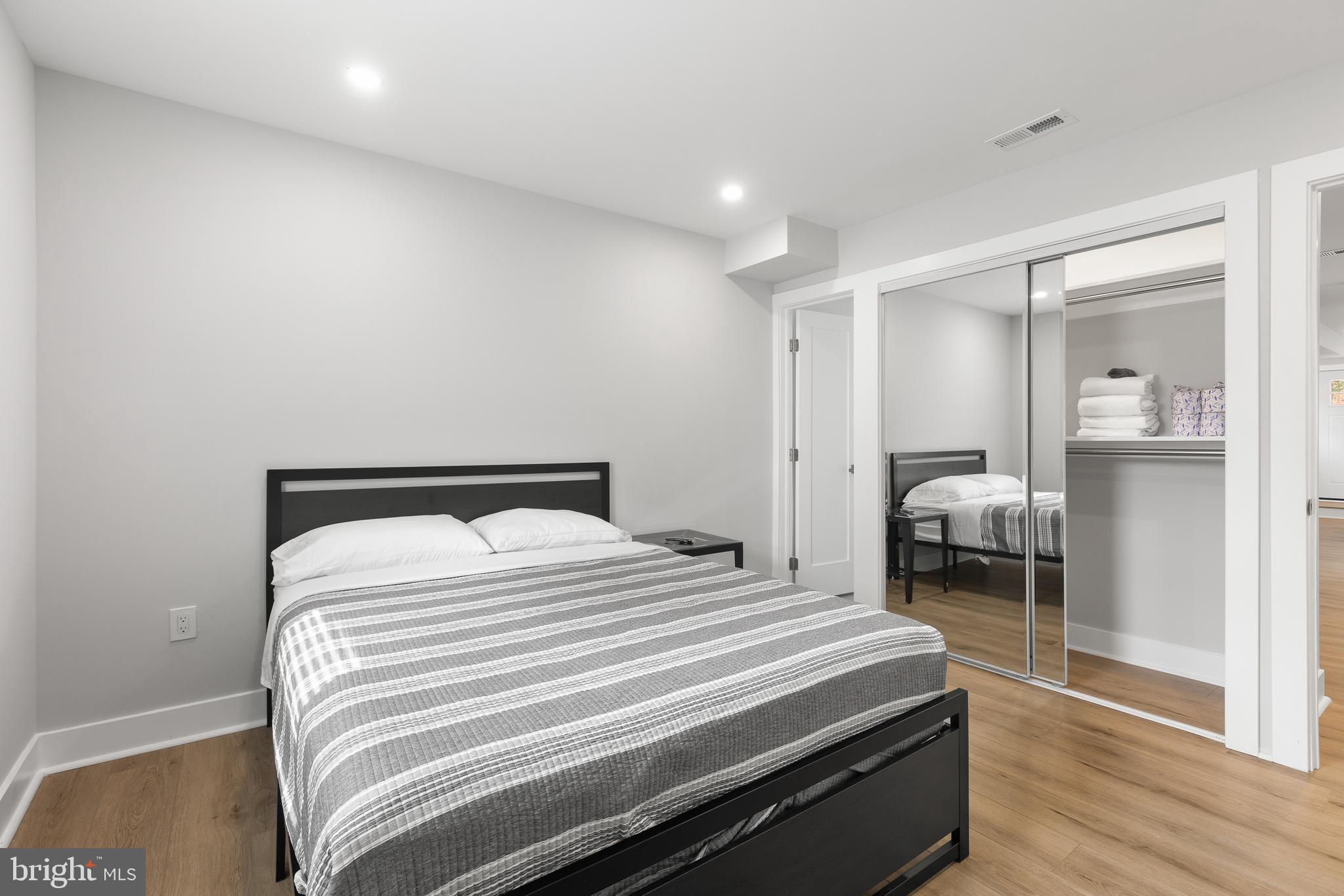 2918 17th Street South Arlington, VA 22204 - Photo 14 of 30 a bedroom with a bed and a mirror