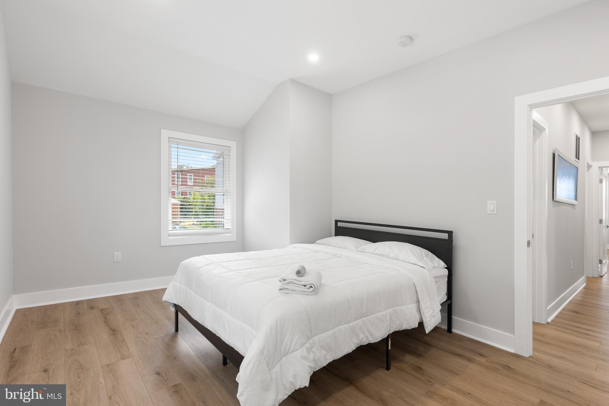 2918 17th Street South Arlington, VA 22204 - Photo 20 of 30 a bedroom with a bed and wooden floor