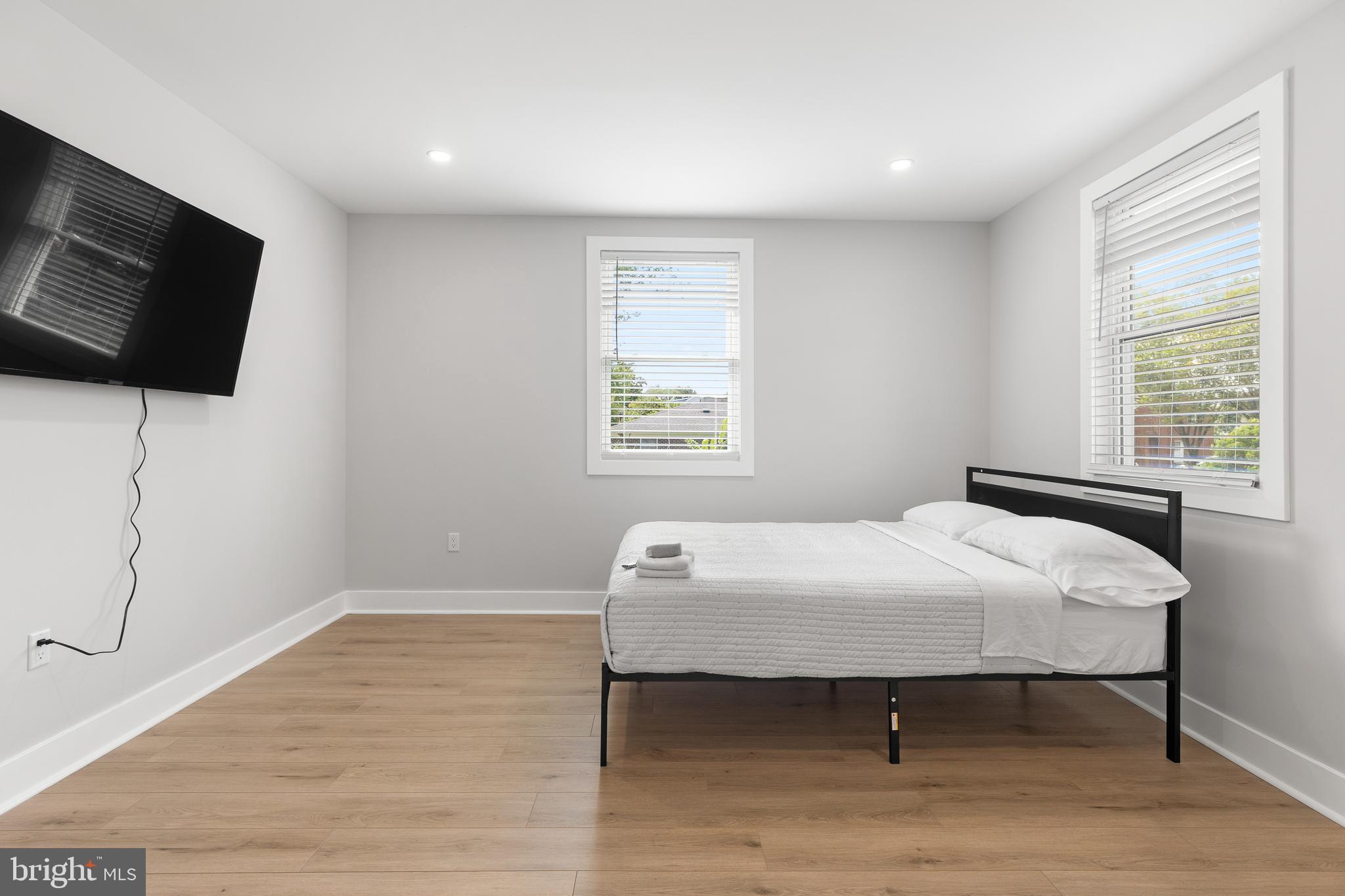 2918 17th Street South Arlington, VA 22204 - Photo 26 of 30 a bedroom with a bed and a flat screen tv