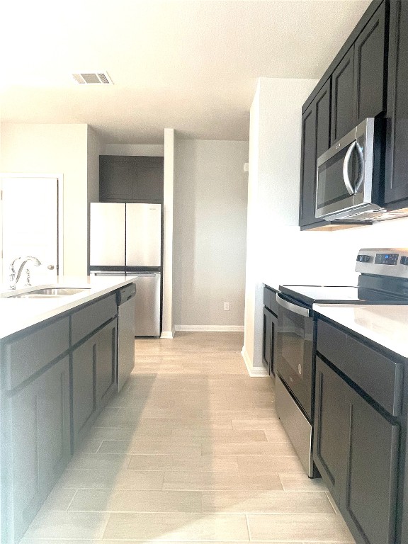 121 Old Stagecoach Road Jarrell, TX 76537 - Photo 8 of 23 a kitchen with stainless steel appliances granite countertop a sink and a stove top oven