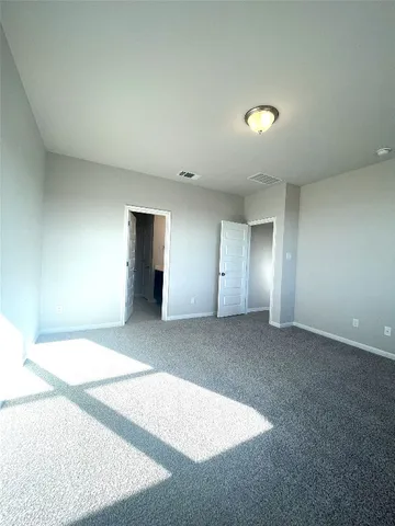 a view of kitchen with kitchen island stainless steel appliances a sink counter space and a window