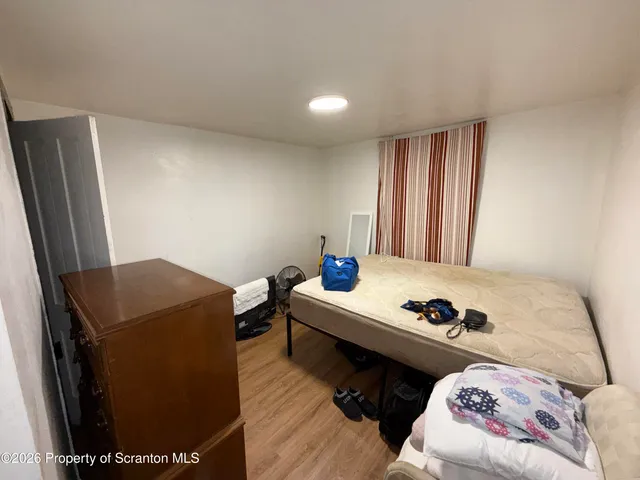 a living room with a couch and a window