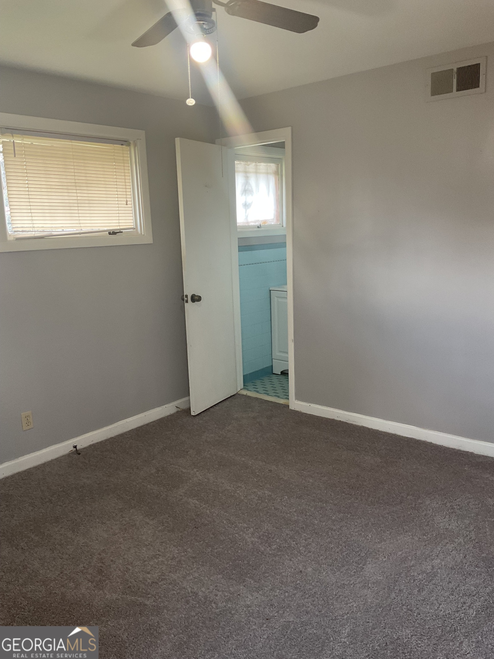 2611 Rice Street Columbus, GA 31903 - Photo 7 of 11 an empty room with windows