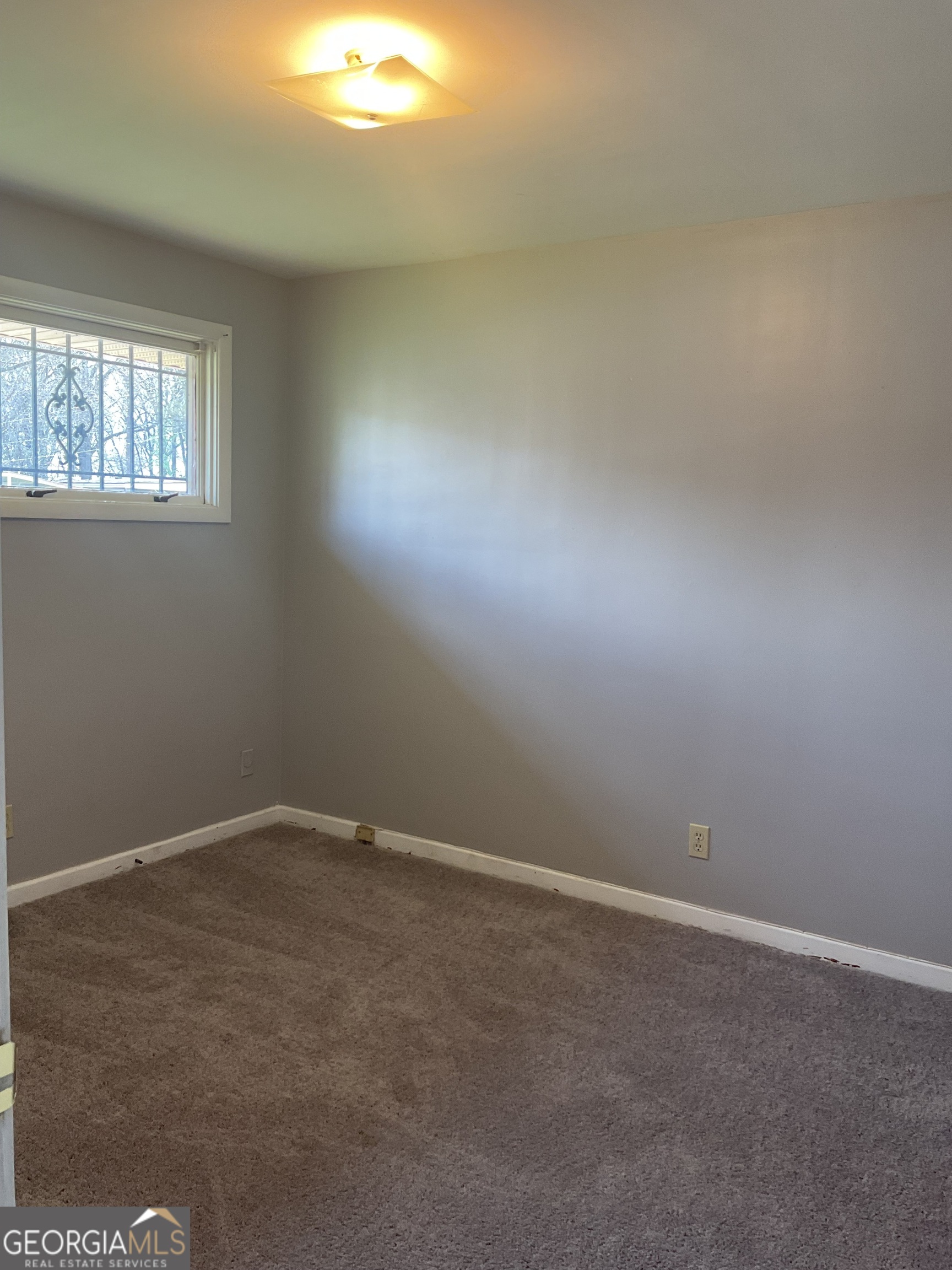 2611 Rice Street Columbus, GA 31903 - Photo 10 of 11 an empty room with windows