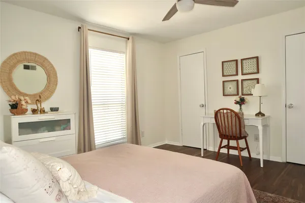 a bedroom with a bed and a chair