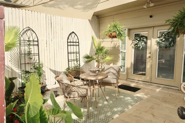 a living room with fireplace furniture and a floor to ceiling window