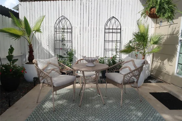 a view of a house with swimming pool and sitting area