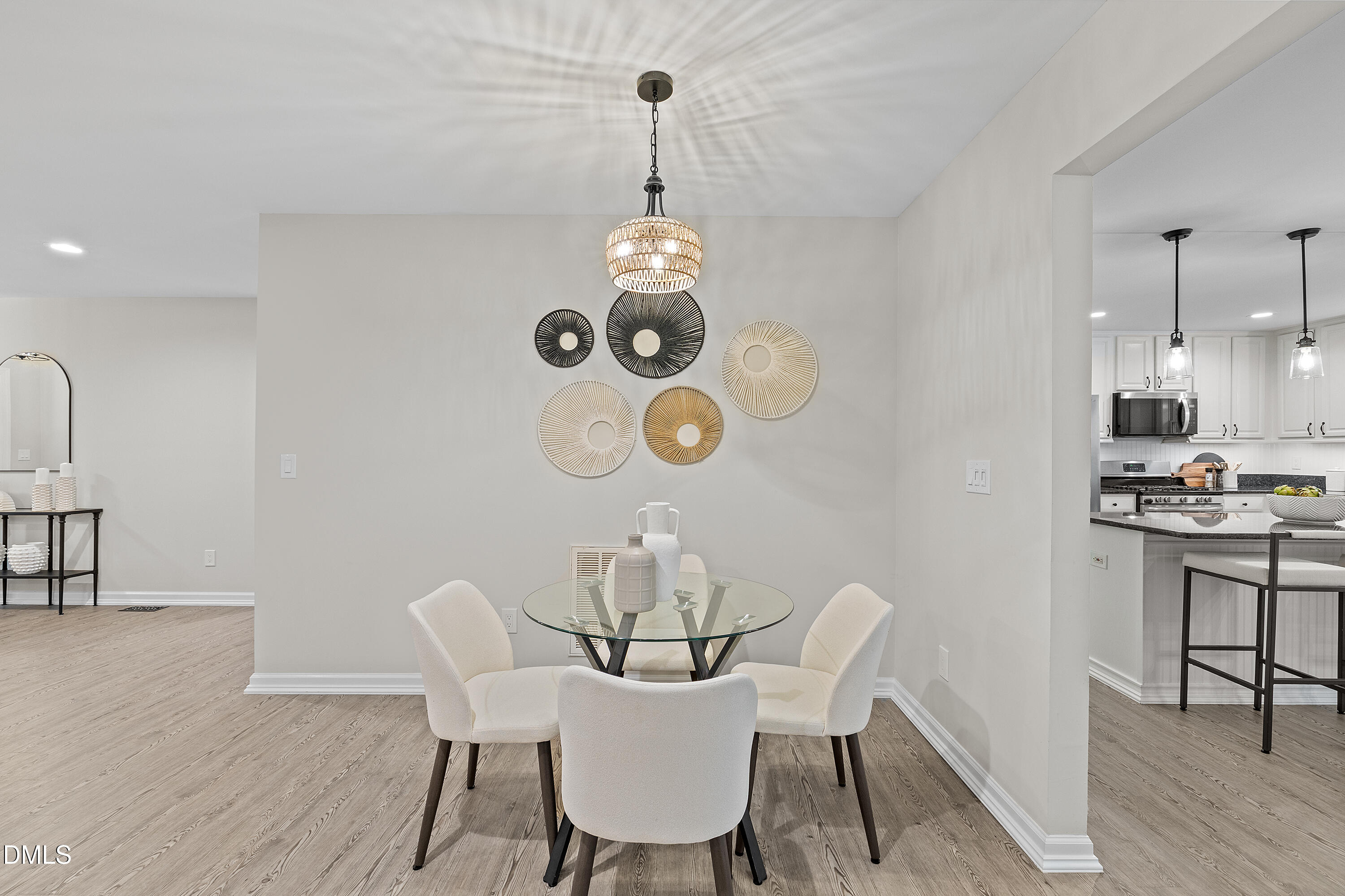 7119 Wexford Woods Trail Raleigh, NC 27613 - Photo 15 of 41 a view of a dining room with furniture wooden floor and chandelier