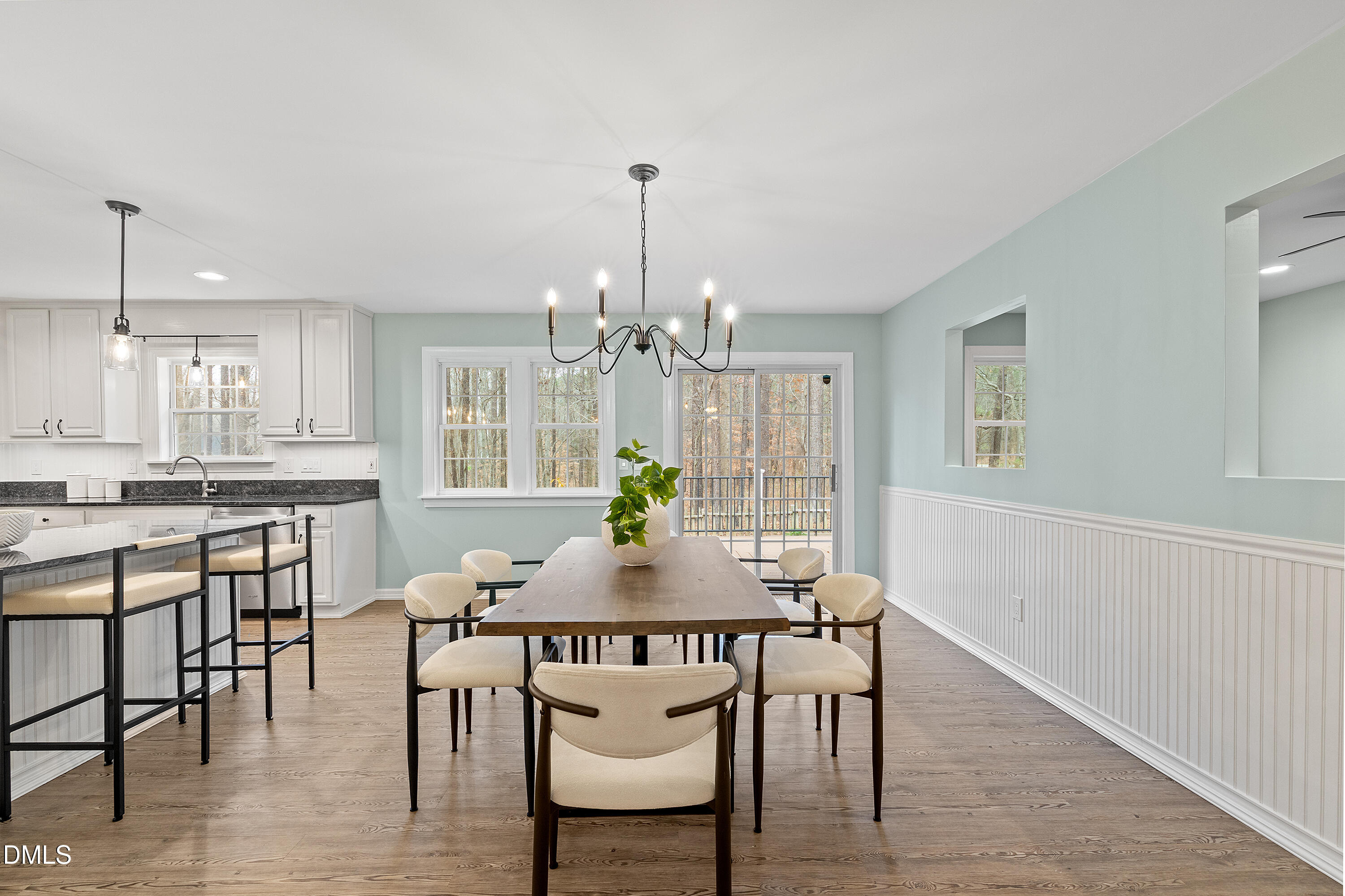 7119 Wexford Woods Trail Raleigh, NC 27613 - Photo 17 of 41 a view of a dining room with furniture window and wooden floor