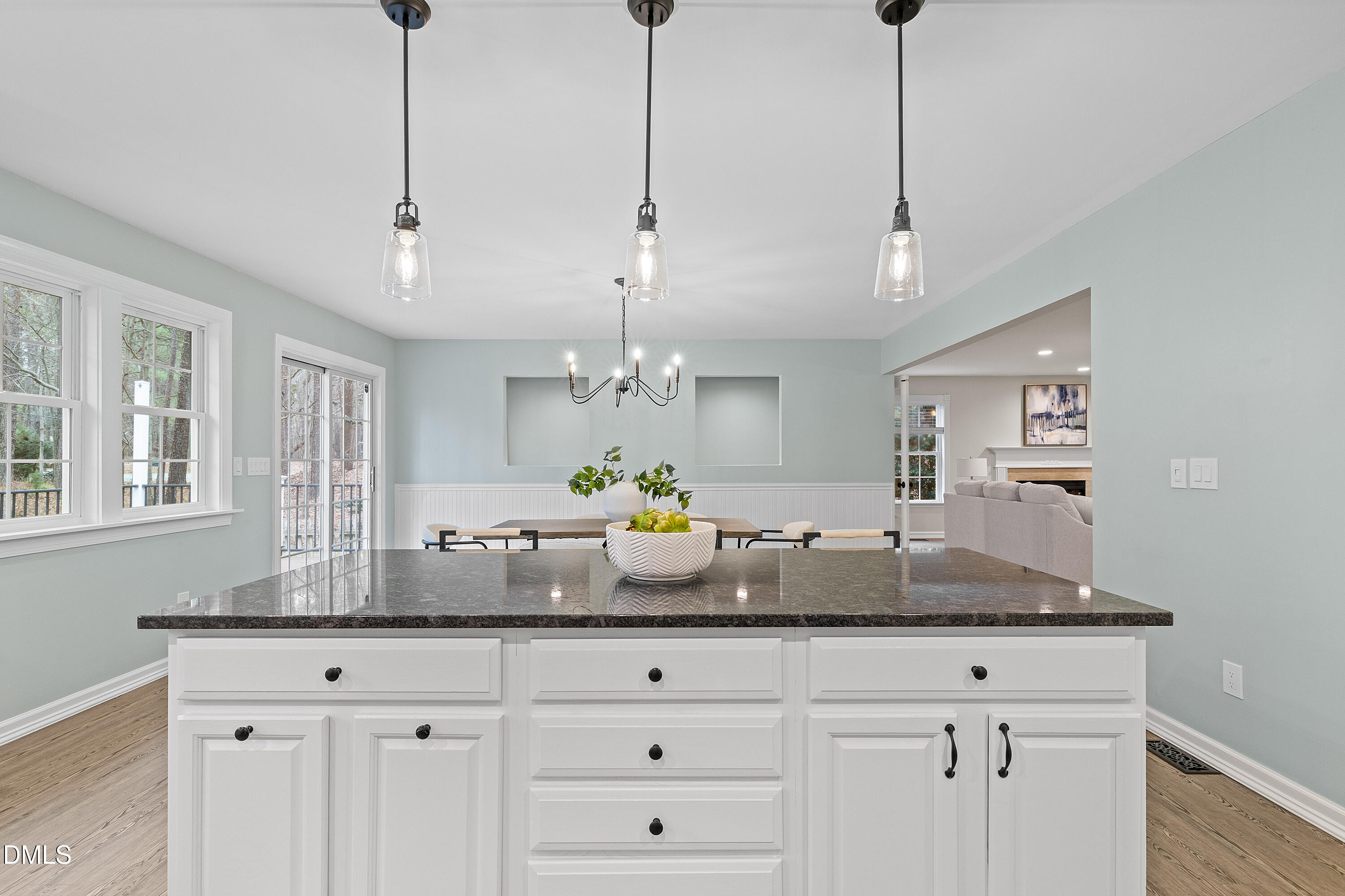 7119 Wexford Woods Trail Raleigh, NC 27613 - Photo 21 of 41 a view of a center island and chandelier