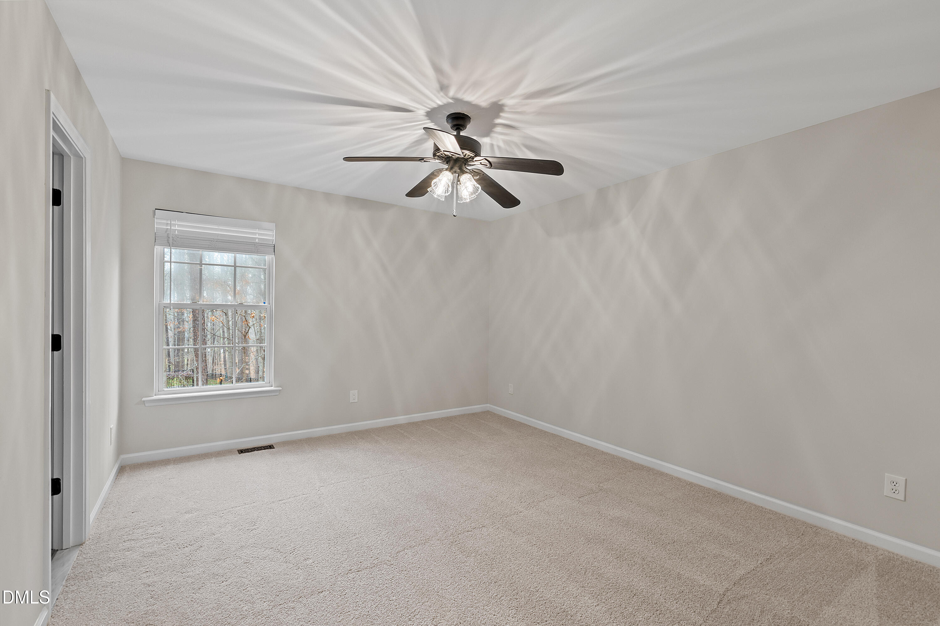 7119 Wexford Woods Trail Raleigh, NC 27613 - Photo 30 of 41 wooden floor in an empty room with a window