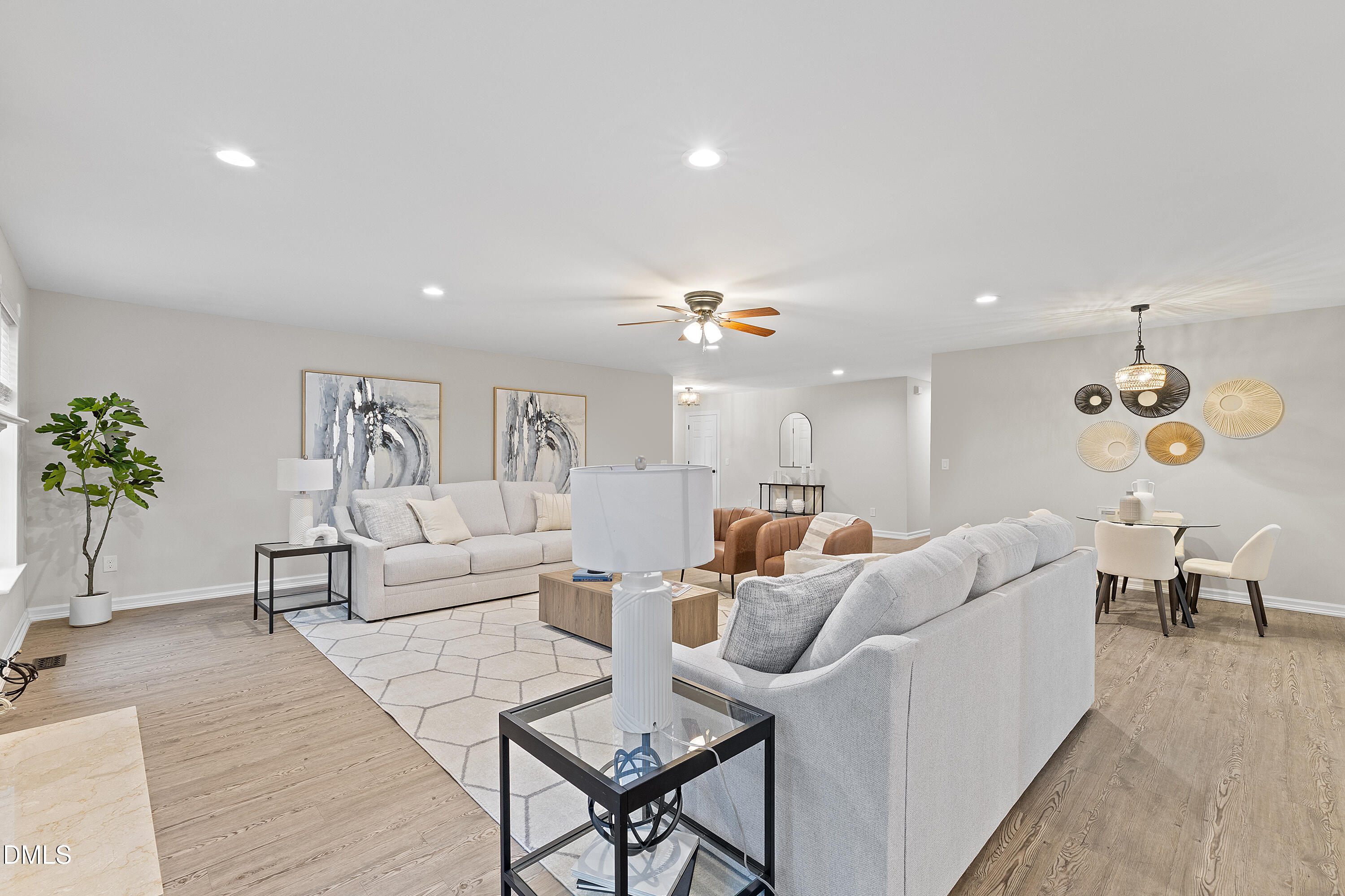 7119 Wexford Woods Trail Raleigh, NC 27613 - Photo 5 of 41 a living room with furniture and a chandelier