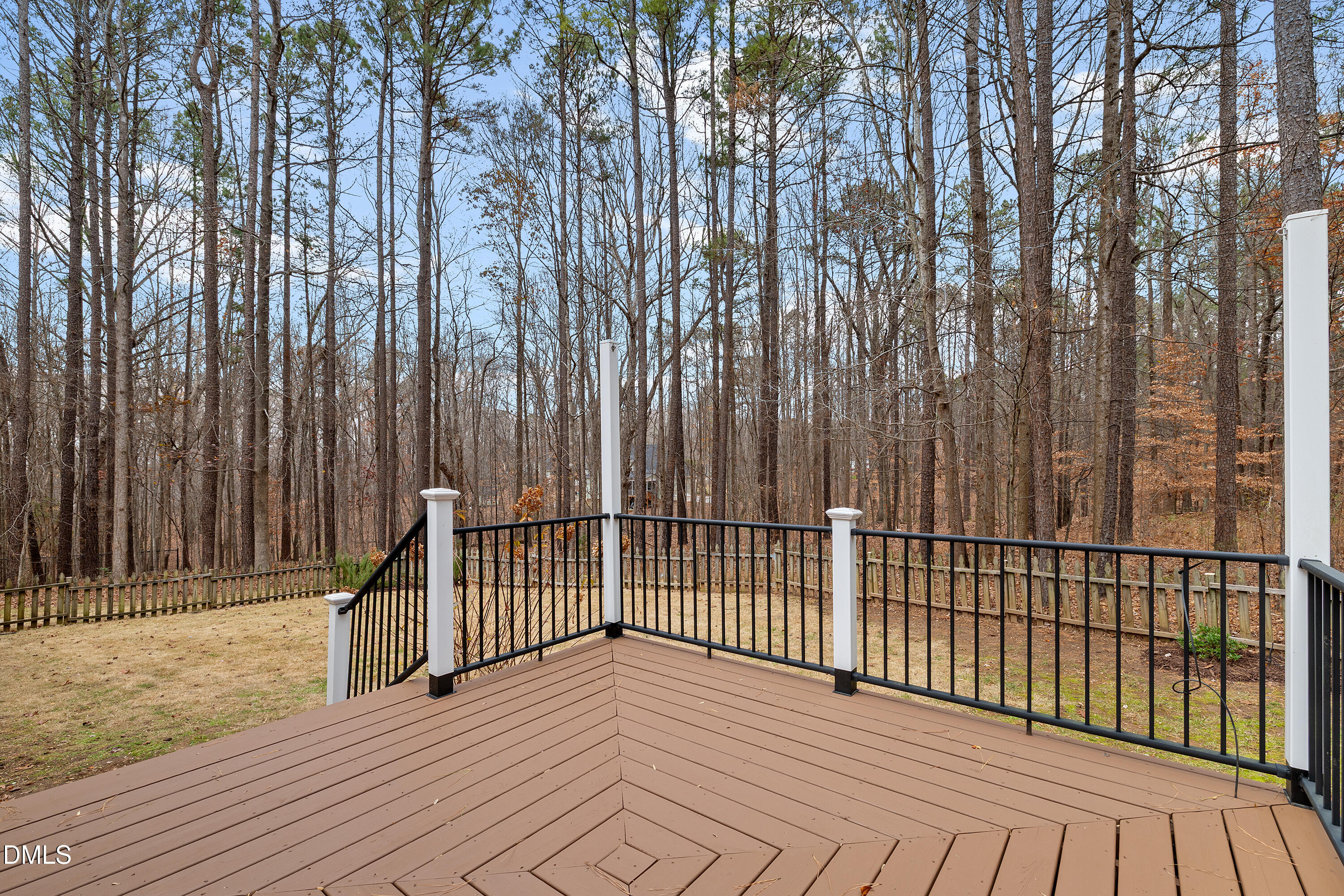 7119 Wexford Woods Trail Raleigh, NC 27613 - Photo 7 of 41 a view of deck with patio and wooden fence