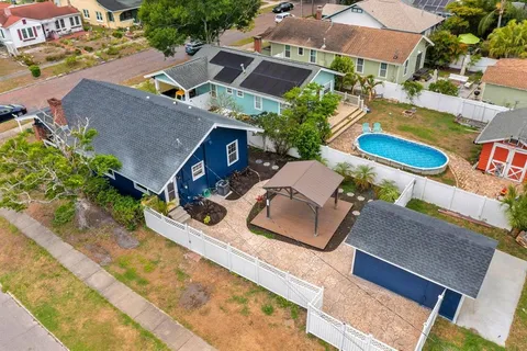 an aerial view of a house with swimming pool