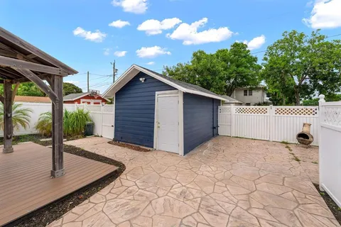 a view of a chairs and table in a patio
