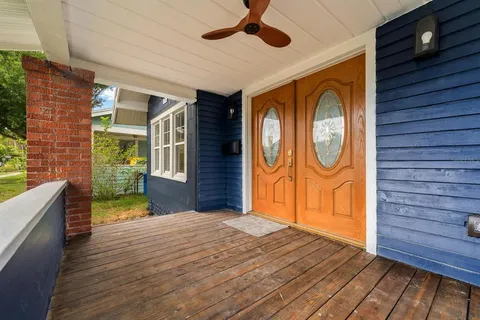 a view of a door and wooden floor