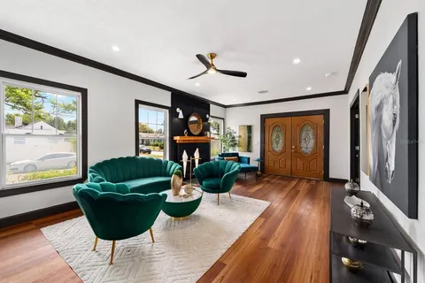 a living room with furniture and a fireplace