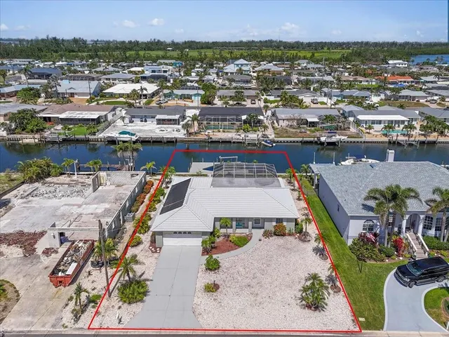 an aerial view of houses with outdoor space