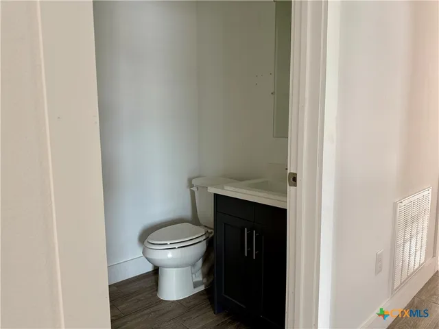 a bathroom with a toilet and a sink