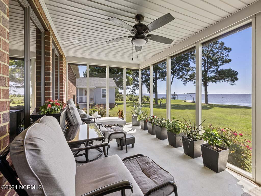 145 Ferry Dock Road Knotts Island, NC 27950 - Photo 36 of 79 Enclosed Back Porch