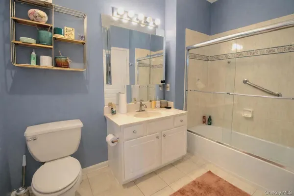 a bathroom with a toilet sink and shower