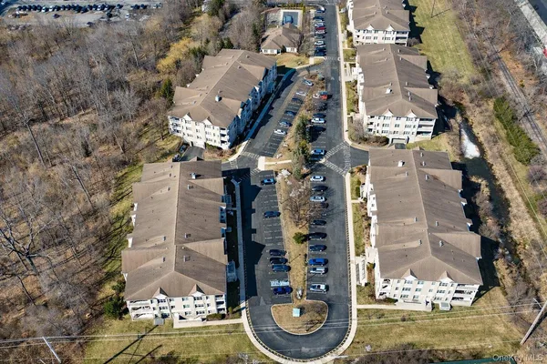 an aerial view of residential house and green space