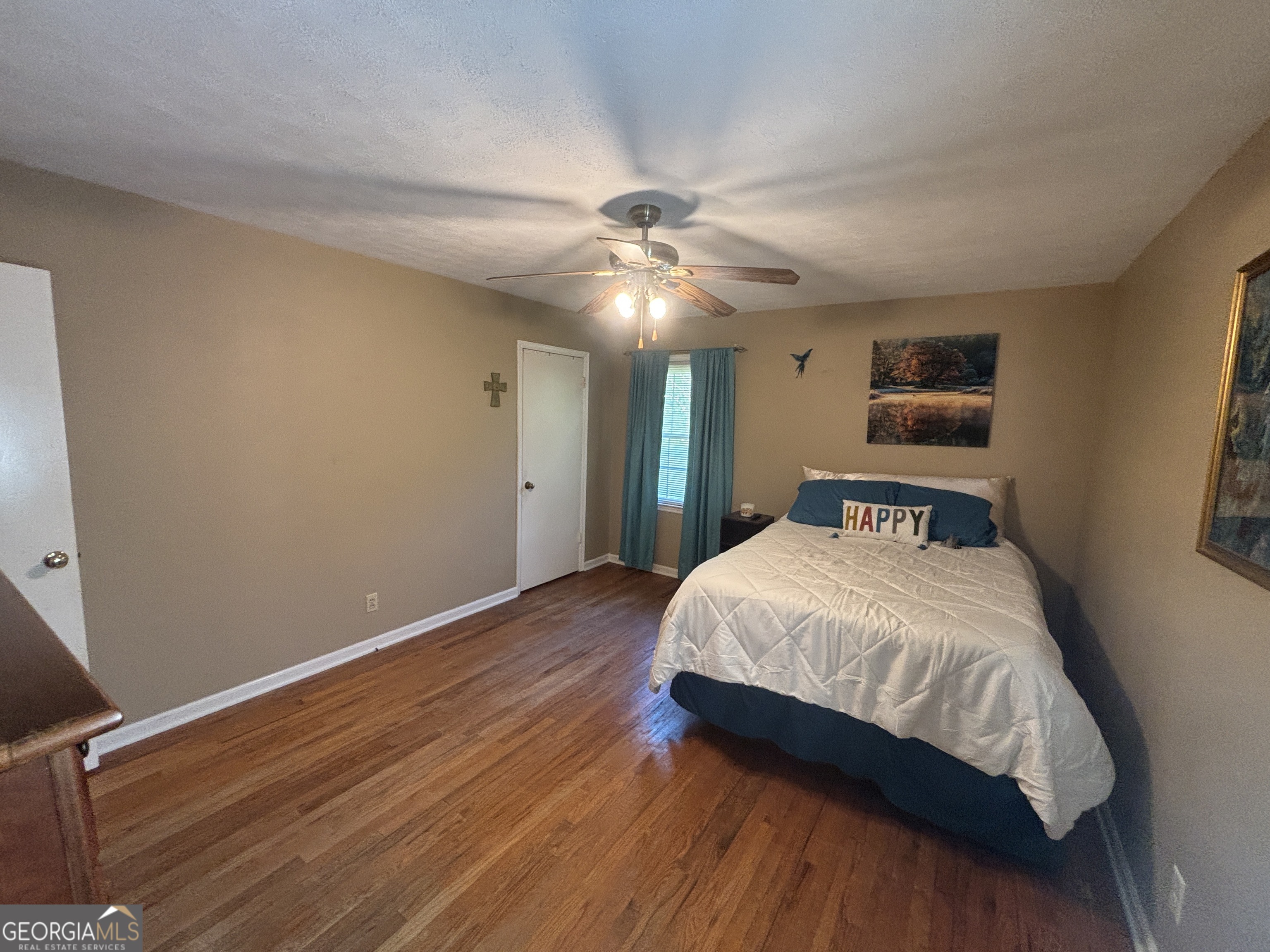 152 Crest Drive Cochran, GA 31014 - Photo 20 of 54 a bedroom with a bed and a chandelier