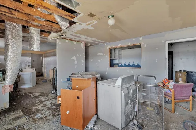 a living room with furniture a rug and a large window