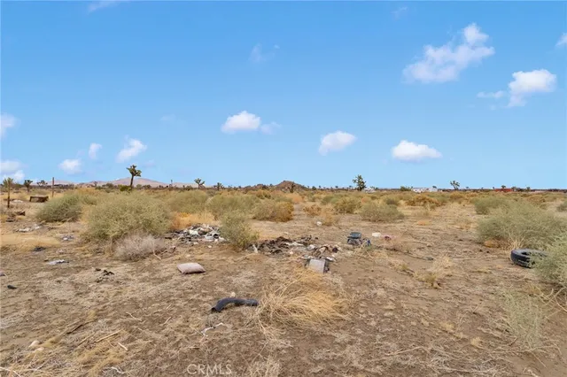 a view of a terrace with chairs and fire pit