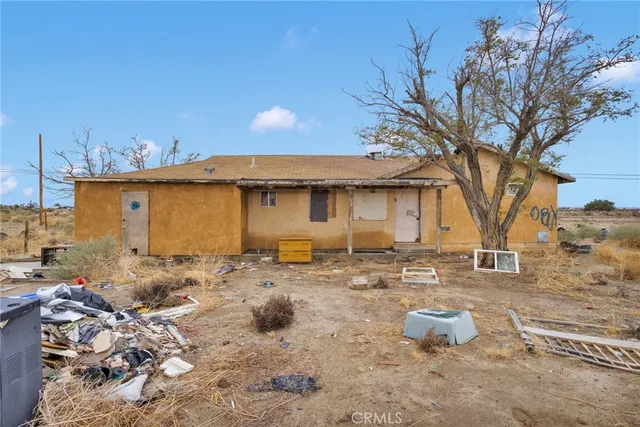 a view of a house with a snow in the yard
