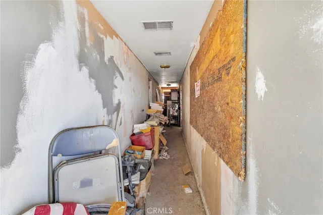 a view of a patio with couches chairs and a stove