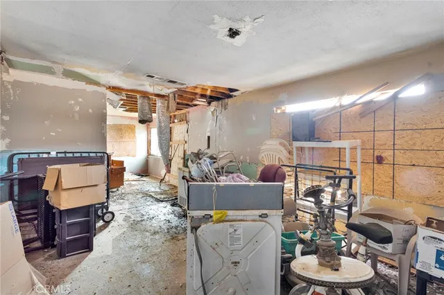 a bed room with a bed and a dresser