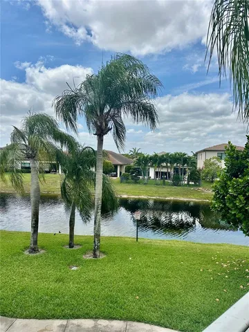 a view of a lake with a yard
